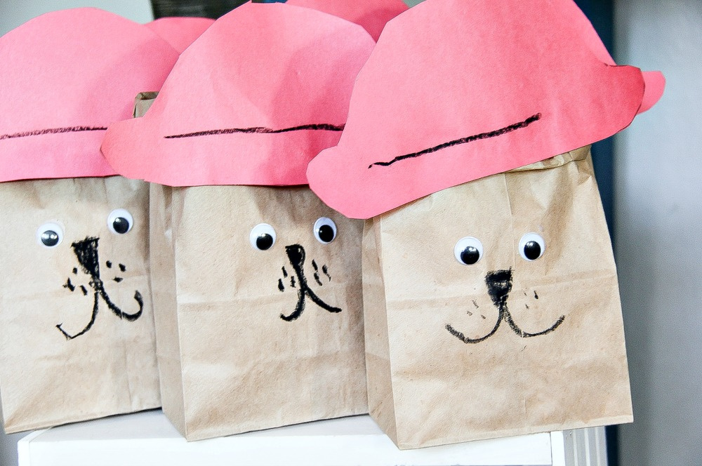 brown paper bags that look like Paddington filled with popcorn