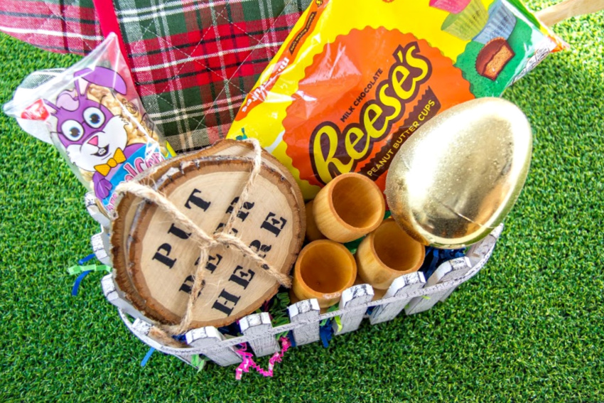 easter basket for college guys including beer coasters, kitchen items, treats, and money