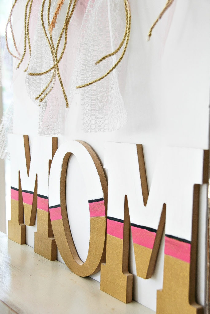 gold pink and white mom wood sign