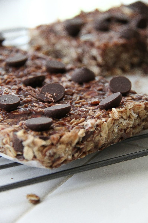 homemade granola bars with chocolate chips on a wire rack