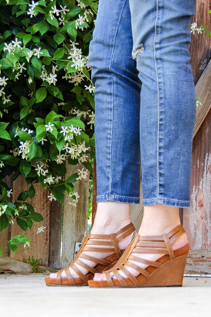 lady wearing denim jeans with brown wedge sandals