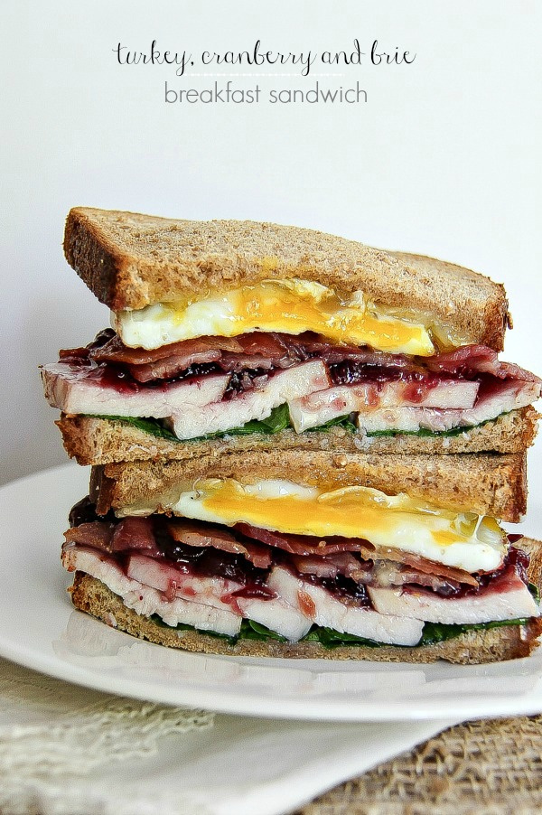 a breakfast sandwich with turkey, cranberry, egg, and brie