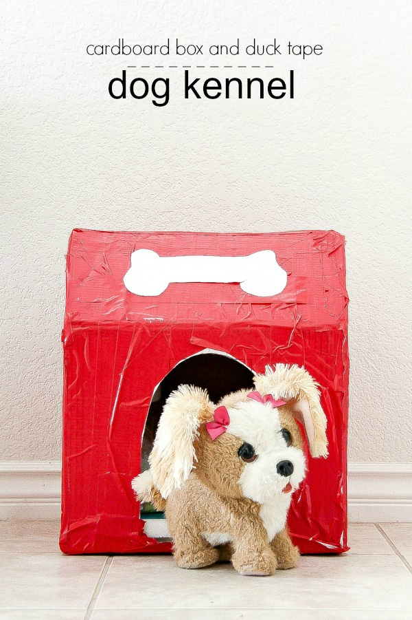 cardboard box and duck tape dog kennel in red and white with a toy dog sitting in it