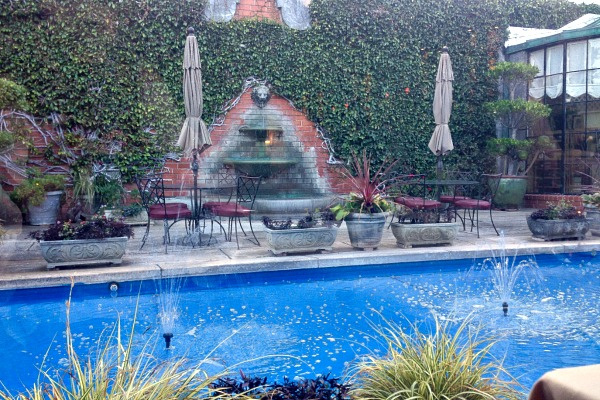 courtyard window with gardens and outdoor dining in carmel