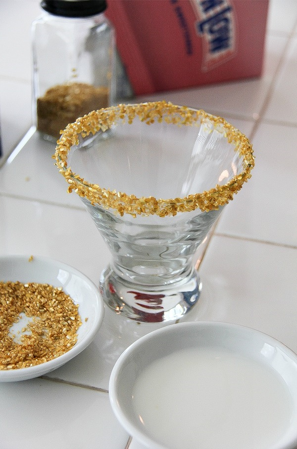 a cocktail glass rimmed in gold flecks