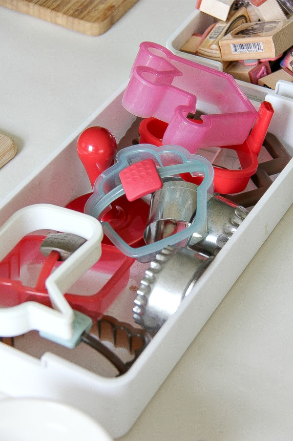 cookie and sandwich cutters in a container for crafting
