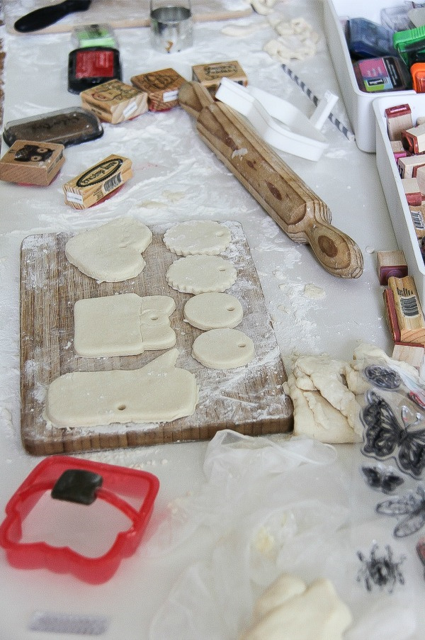 salt dough ornaments that have been cut out on a cutting board