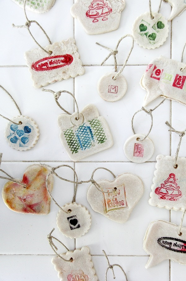 salt dough ornaments that have been stamped with designs on a counter