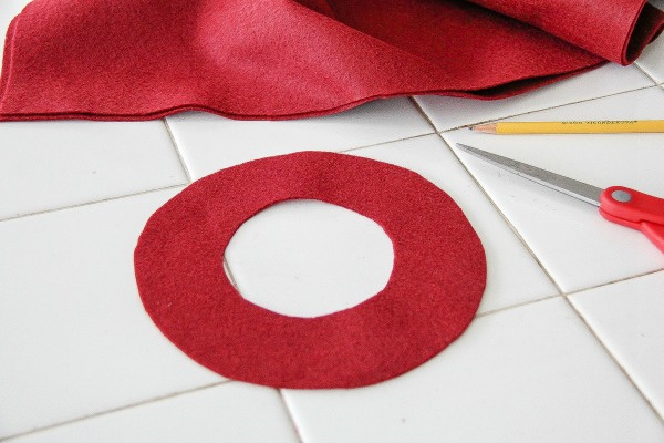 red felt circles cut out to make the brim of a hat