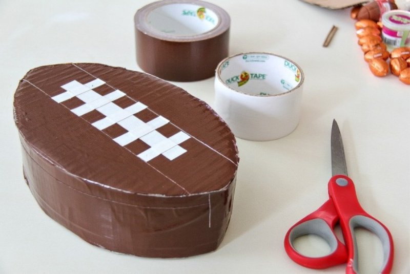 A football pinata made with brown tape