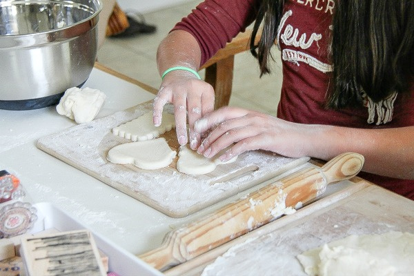 girl making heart shaped salt dough ornaments