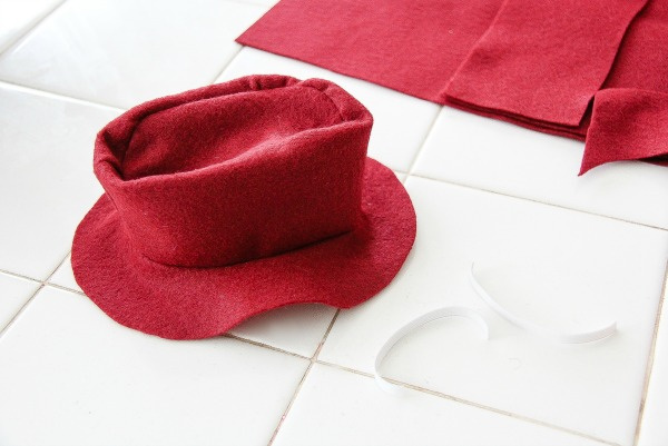 a red floppy hat made out of felt for a teddy bear