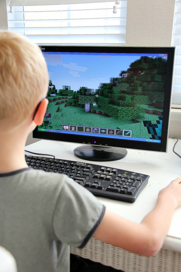 Boy using Minecraft on a desktop