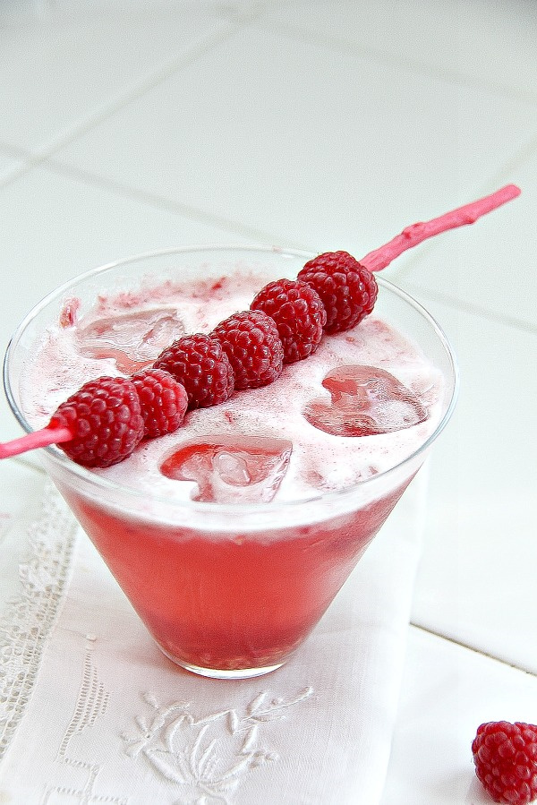 a cocktail glass with a pink cocktail for valentine's day