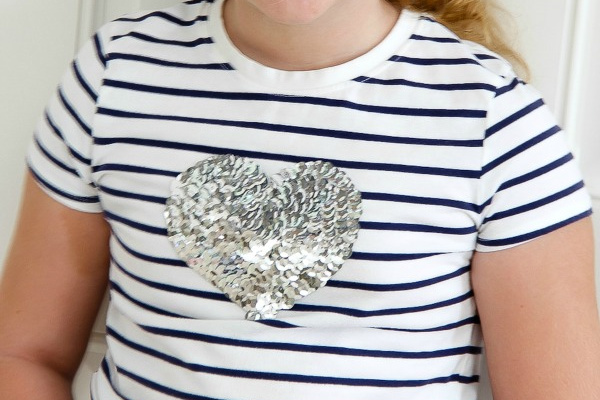 sequins in the shape of a heart on a striped tee