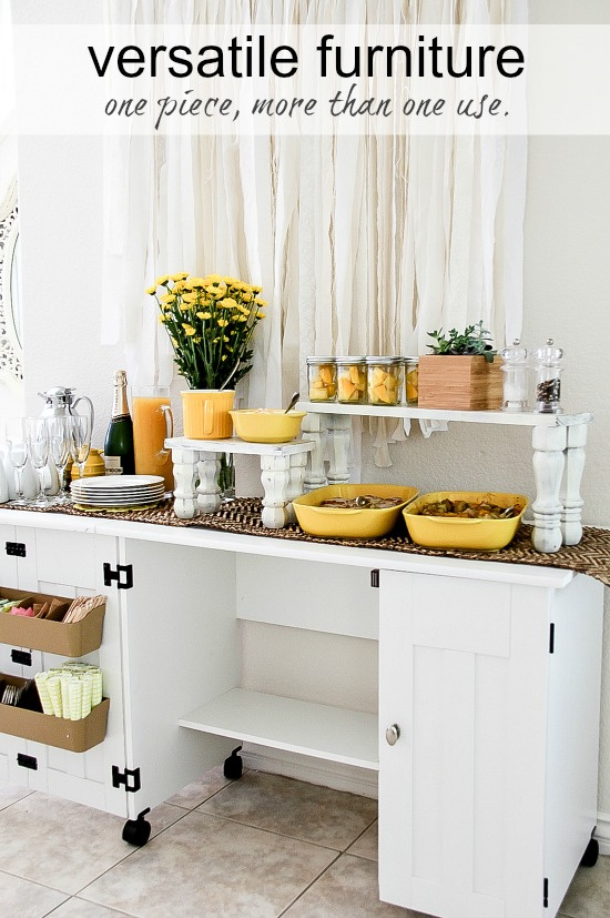 a white sewing table being used as a party food table