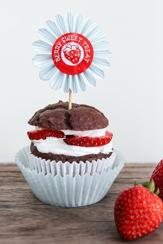 chocolate cupcake with strawberries and cream layered on top
