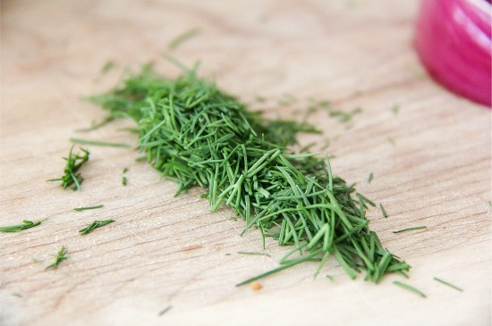 chopped fresh chives on a cutting board