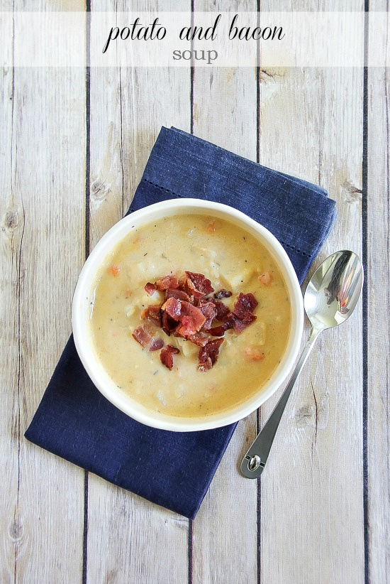 potato and bacon soup in a bowl on a blue napkin