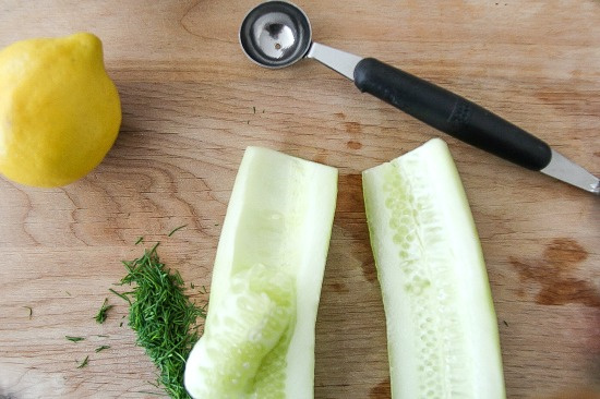 removing seeds from a cucumber with a melon baller