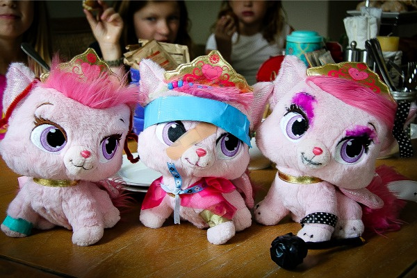 plush pink kitties after girls have given them makeovers