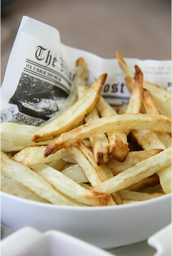 french fries on newspaper print made in the airfryer