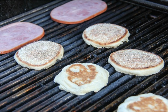 english muffins and ham steaks on the grill