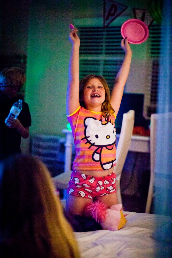 a girl in Hello Kitty pajamas during a sleepover