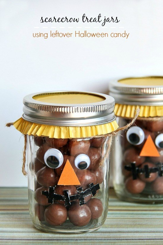 canning jars filled with chocolate balls and decorated like a scarecrow