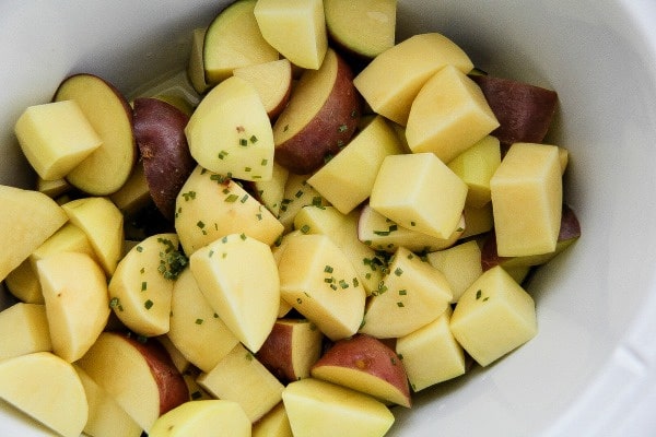 potatoes cut up and placed in a slow cooker