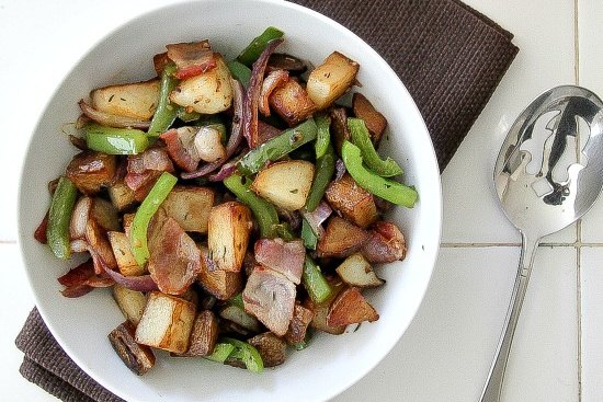 potato, bacon, and green peppers in a white bowl for breakfast