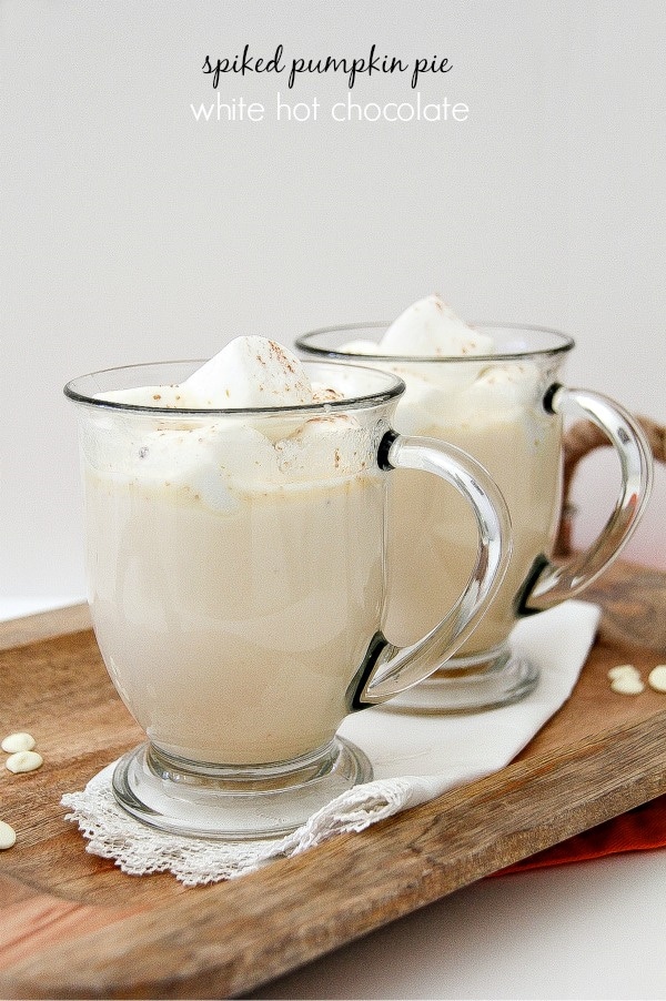 white hot chocolate in a clear mug with marshmallows on top