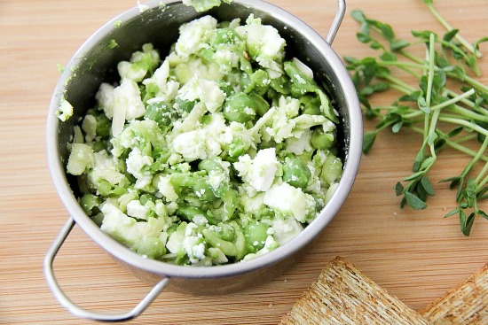 feta cheese mixed with peas and microgreens