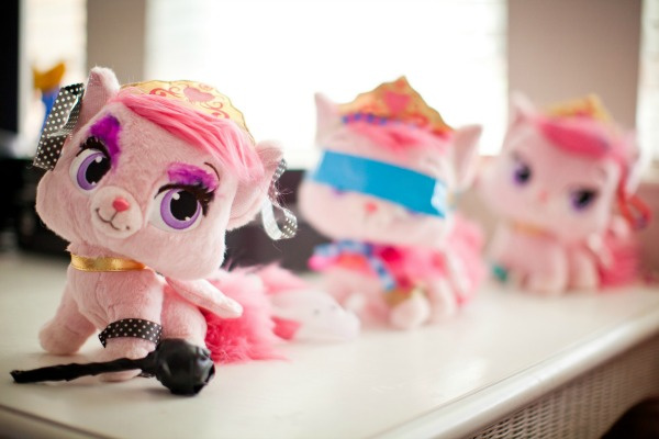 three pink plush kitties after having makeovers