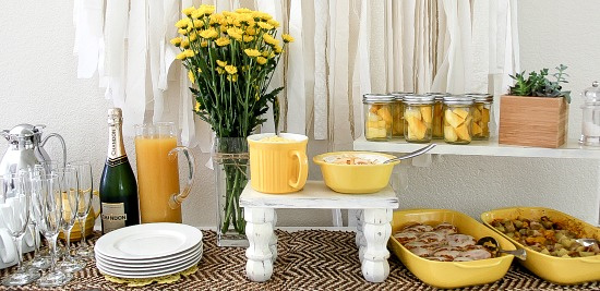 a yellow and white summer brunch table