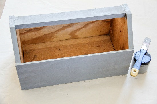 wood caddy being painted grey