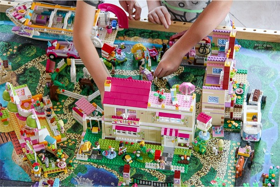 children playing with a LEGO Friends town