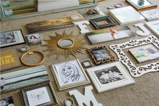 assorted frames being sorted for a gallery wall