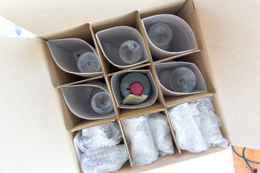 glasses and bottles packed into a box for moving