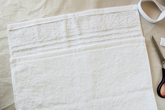 a white hand towel being used as a craft