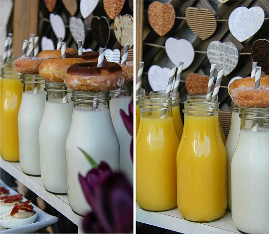 small bottles filled with milk and orange juice and topped with donuts