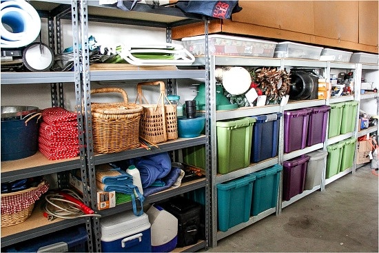 color coded bins in a garage for holiday decorations