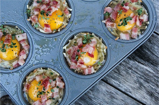 hash browns, egg, bacon, and herbs in muffin tins