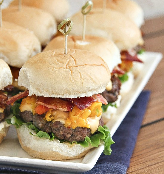 cheeseburger sliders with corn relish and bacon on slider buns