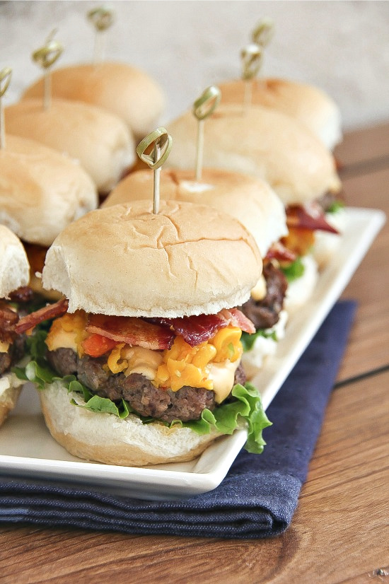 cheeseburger sliders with corn relish and bacon on slider buns