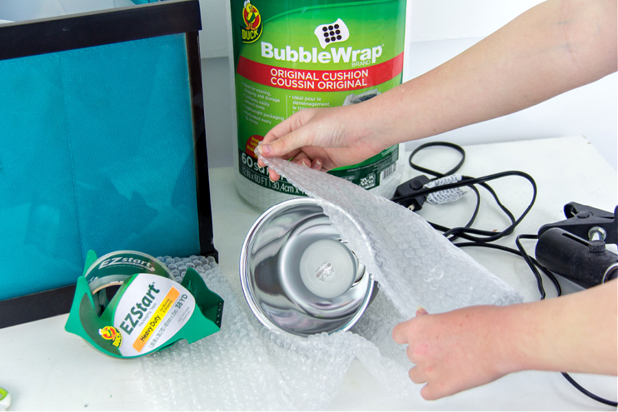 wrapping turtle lights in bubble wrap for packing