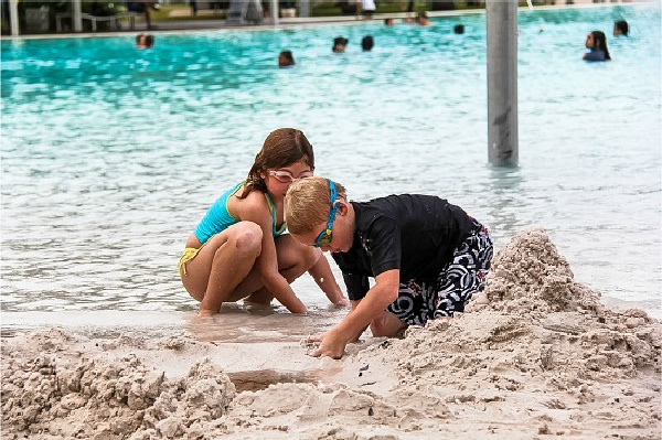 kids playing in the sand at the Cairns Esplanade Lagoon