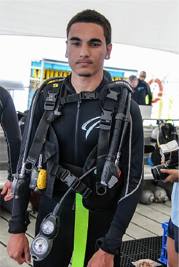 young adult male dressed in scuba diving gear