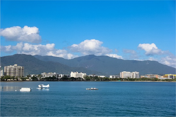 looking back at the mainland from the deck of a boat heading out to the great barrier reef