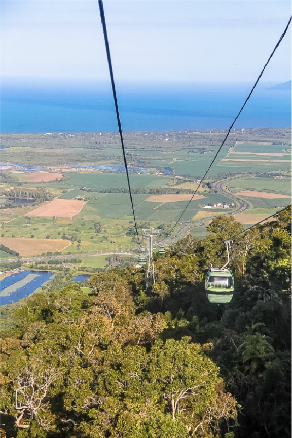 view over the ocean from the kuranda skyrail as it comes down the mountain